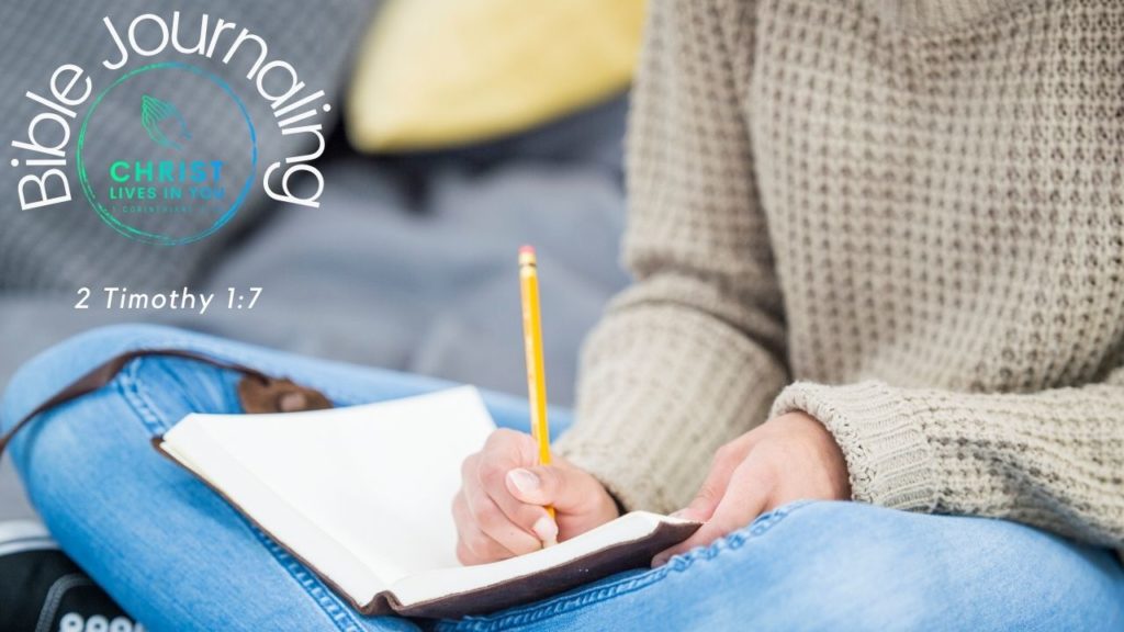A woman sits and journals