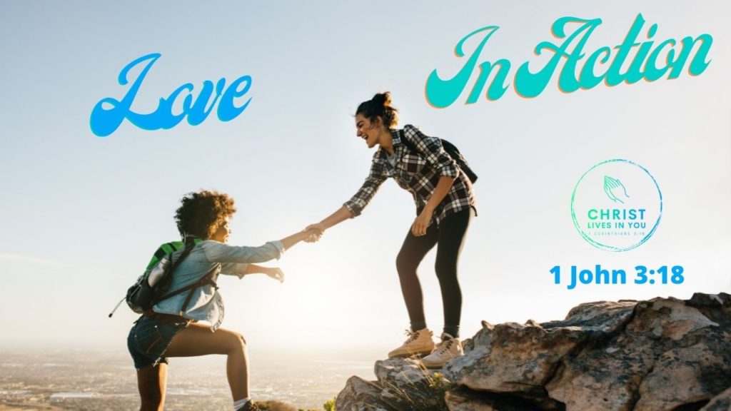 Two friends help each other up a mountain