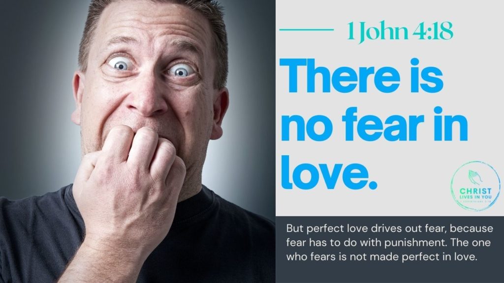 A man bites his nails, his eyes wide in fear