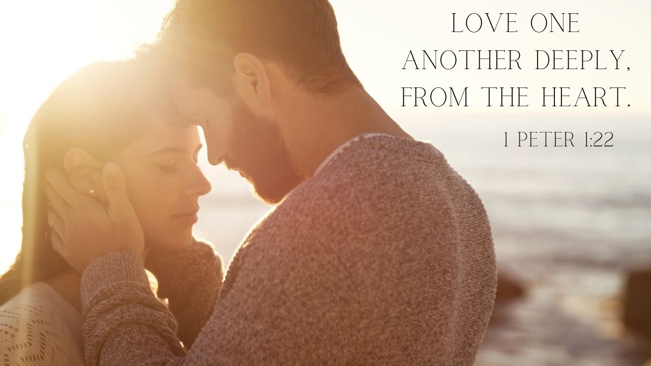 A man and a woman stand with the sun behind them, foreheads touching with a look of deep love