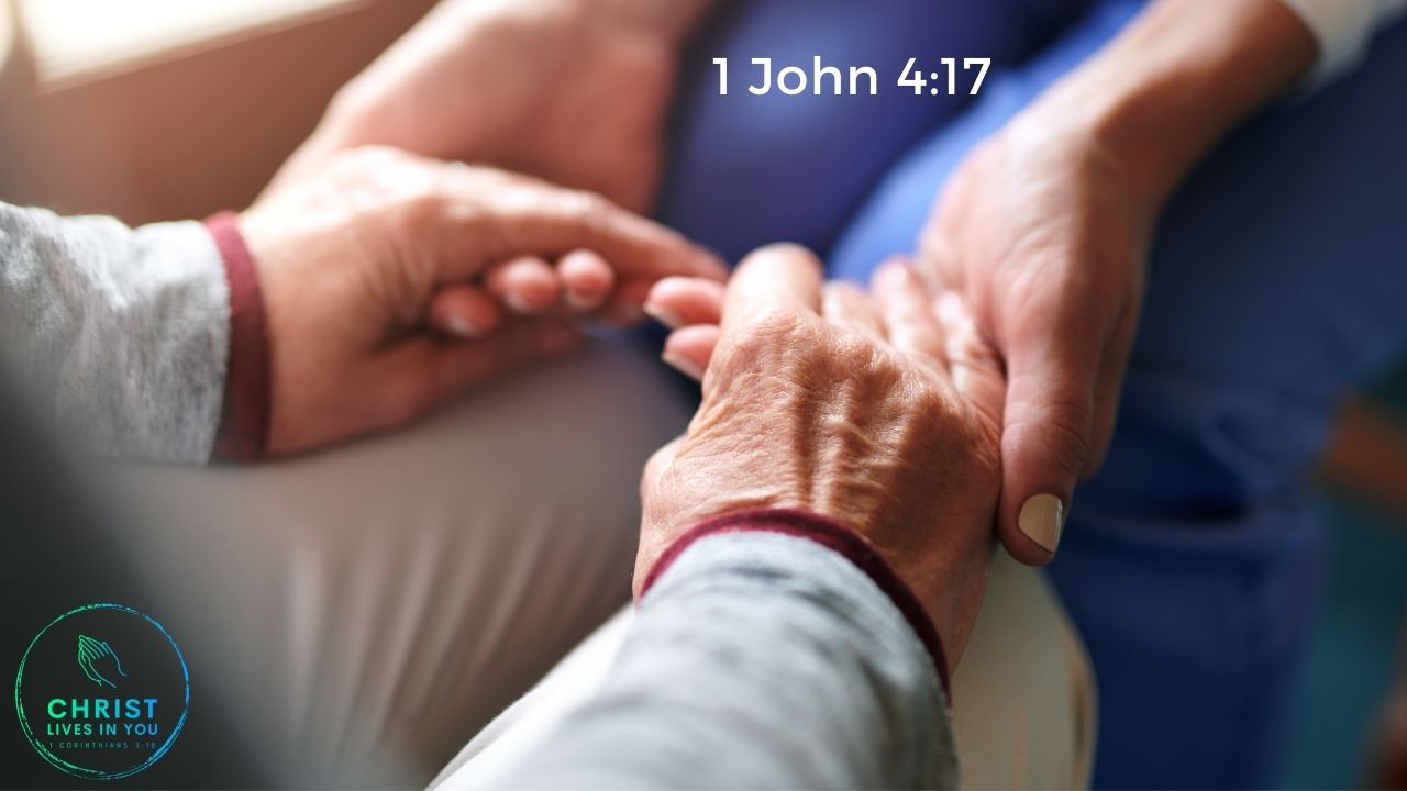 Two people holding hands in support of eachother